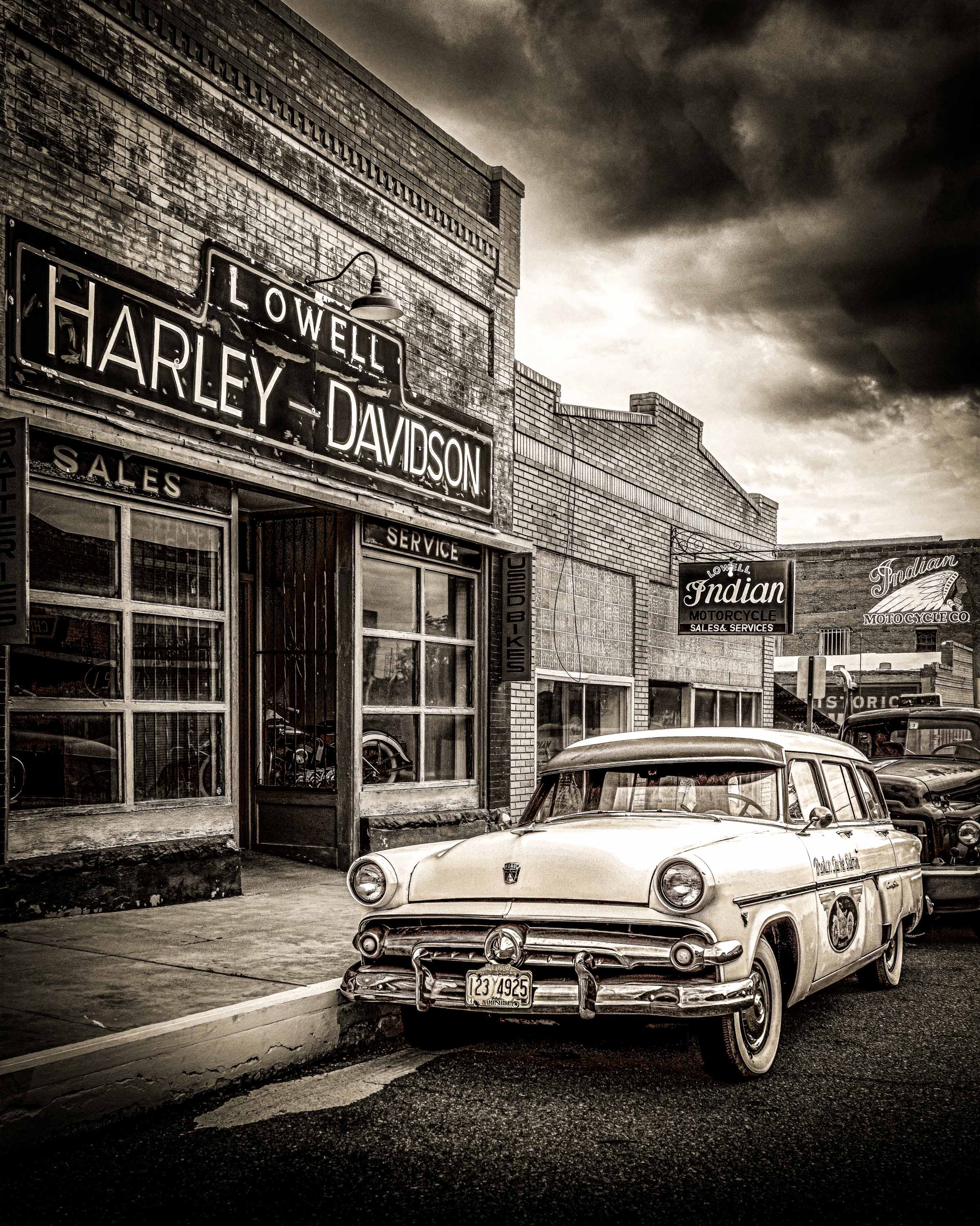 1954 Ford Customline at the old Lowell Harley-Davidson dealership, Bisbee Arizona, black and white